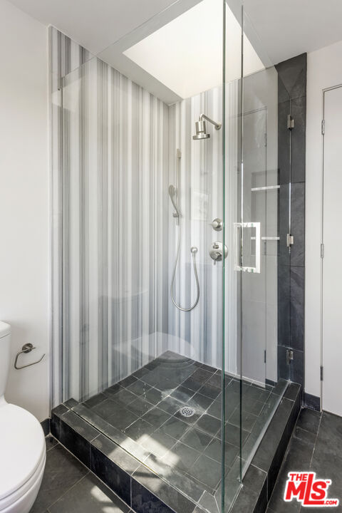 1508 Elevado Street Los Angeles, CA 90026 - Photo 31 of 50 a bathroom with a granite countertop shower and a toilet