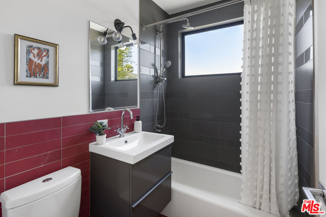 1508 Elevado Street Los Angeles, CA 90026 - Photo 33 of 50 a bathroom with a sink a toilet and shower