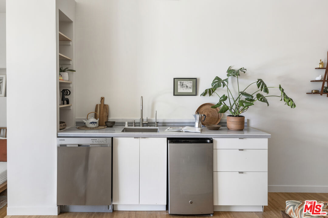 1508 Elevado Street Los Angeles, CA 90026 - Photo 39 of 50 a kitchen with cabinets and plant in it