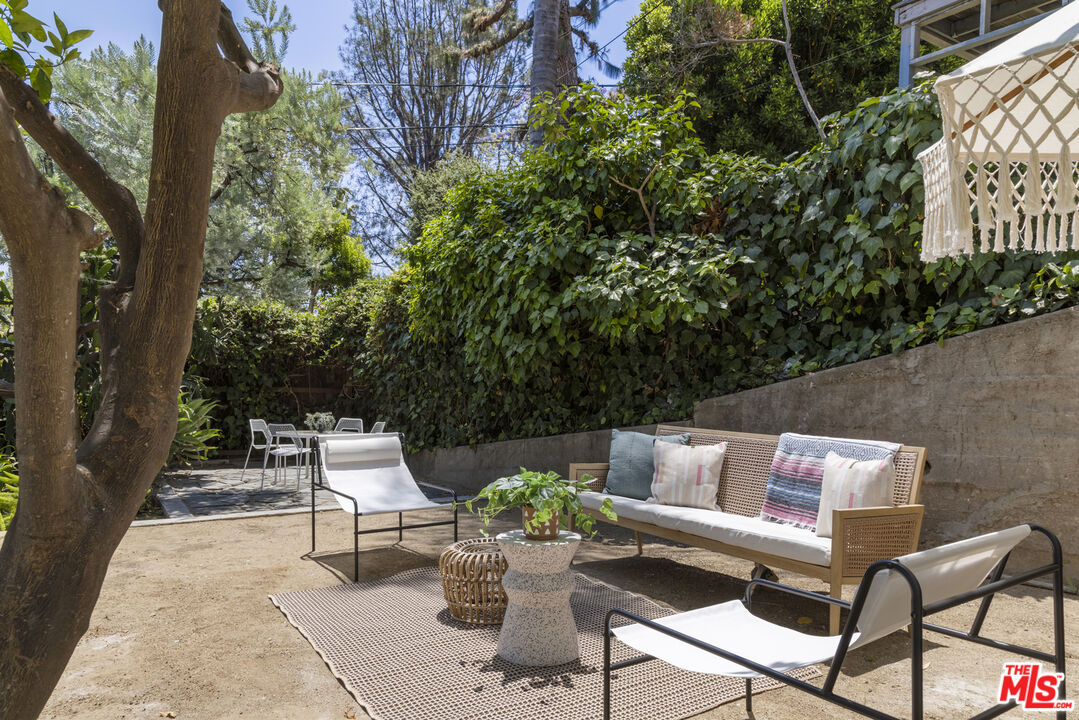 1508 Elevado Street Los Angeles, CA 90026 - Photo 45 of 50 a view of a chairs and table in the backyard