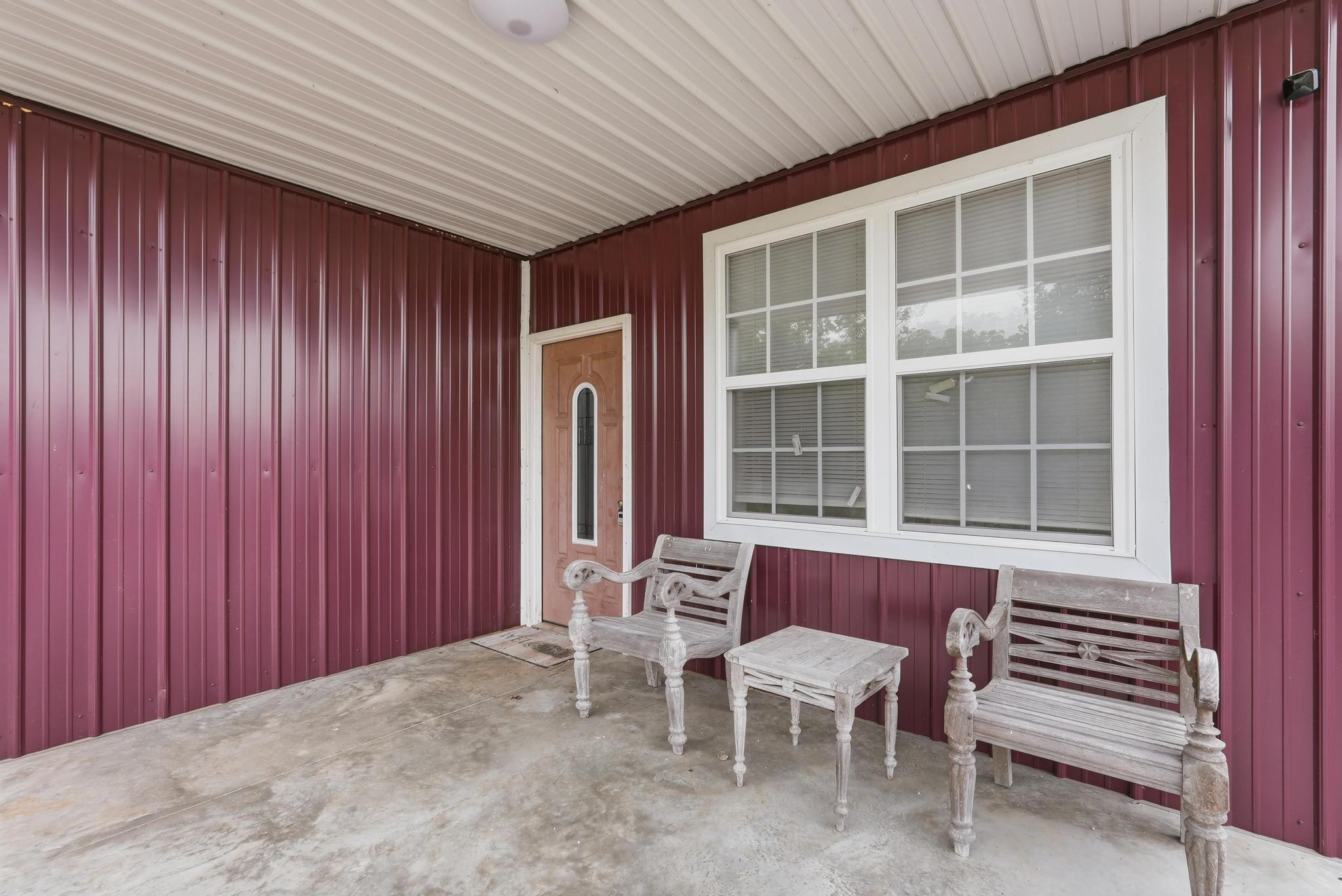 1050 Franks Ferry Road Sparta, TN 38583 - Photo 30 of 35 a view of a room with a table and chairs and wooden walls