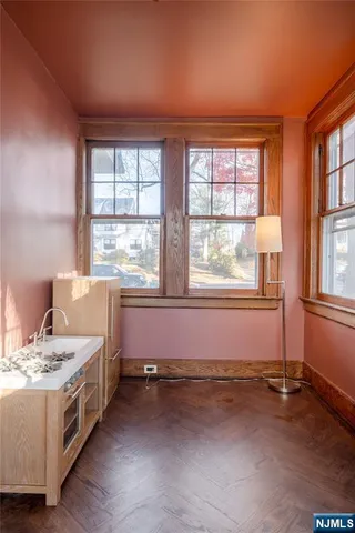 a spacious bedroom with a bed and a window