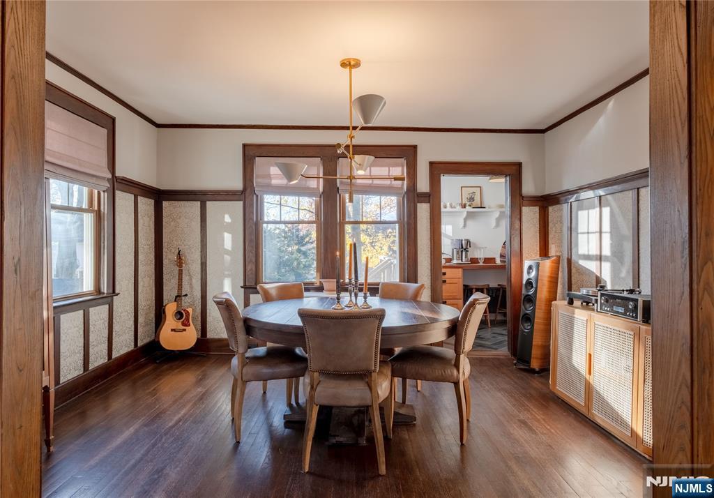 36 Clarendon Place Bloomfield, NJ 07003 - Photo 13 of 48 a dining room with furniture large window wooden floor and a chandelier