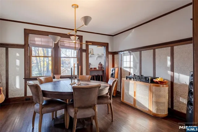a dining room with furniture window wooden floor