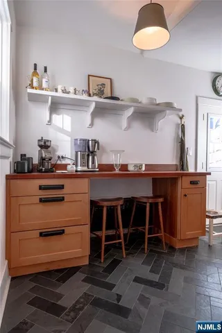 a room with cabinets and chair