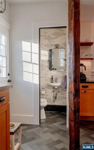 a view of utility room and bedroom