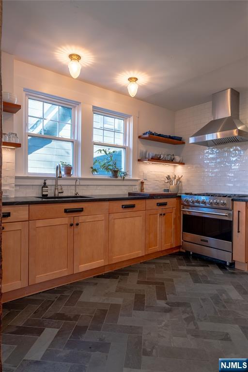36 Clarendon Place Bloomfield, NJ 07003 - Photo 21 of 48 a kitchen with granite countertop a stove and a sink