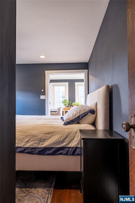 36 Clarendon Place Bloomfield, NJ 07003 - Photo 25 of 48 a bedroom with a bed and wooden floor