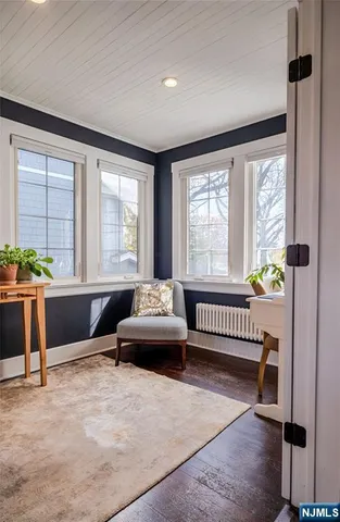 a spacious bedroom with a bed and a large window