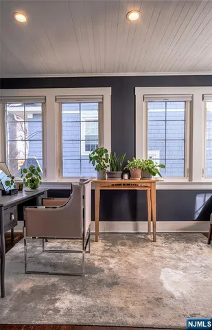 a view of a living room and a potted plant