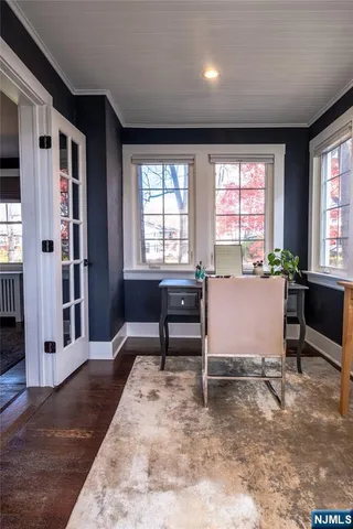 a living room with furniture and windows