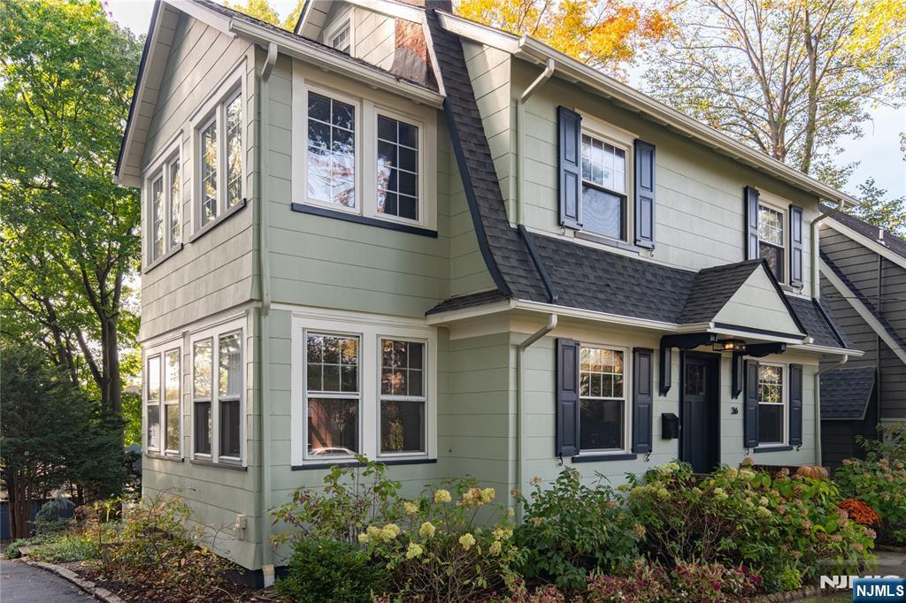 36 Clarendon Place Bloomfield, NJ 07003 - Photo 3 of 48 a view of a white building among the large windows
