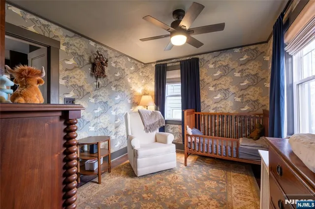 a bedroom with furniture and window