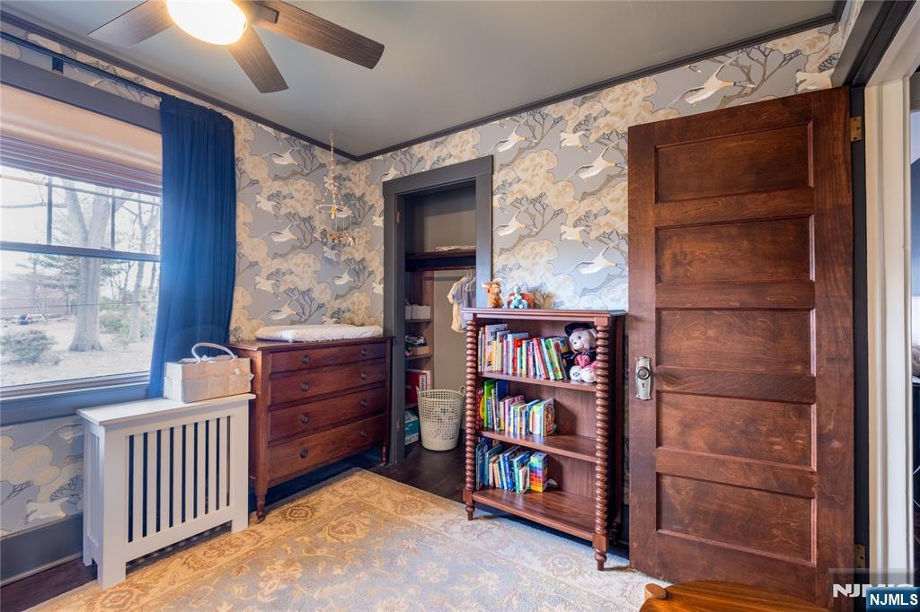 36 Clarendon Place Bloomfield, NJ 07003 - Photo 33 of 48 a room with furniture and a book shelf