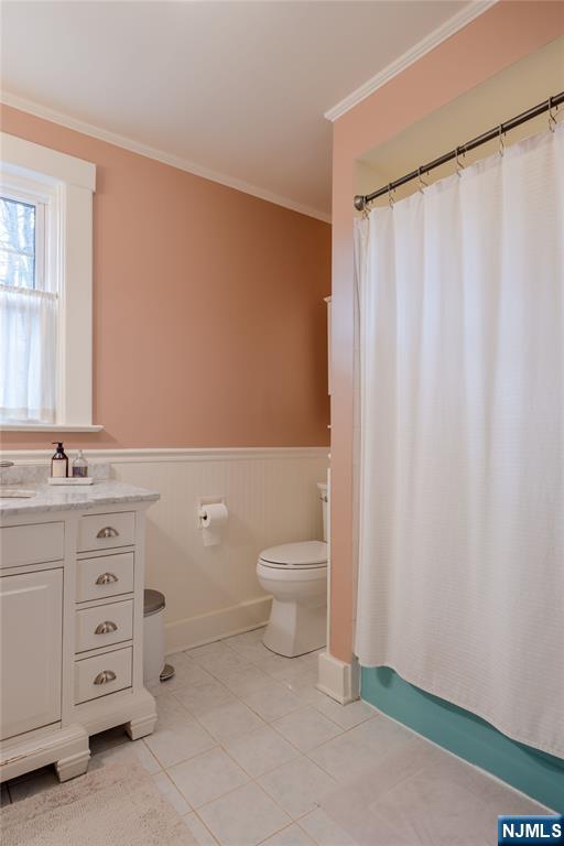 36 Clarendon Place Bloomfield, NJ 07003 - Photo 39 of 48 a bathroom with a granite countertop sink toilet and a mirror