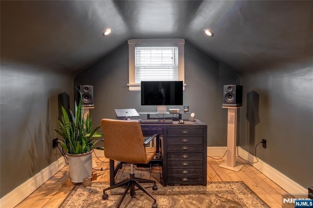36 Clarendon Place Bloomfield, NJ 07003 - Photo 41 of 48 a view of a workspace with furniture and a potted plant