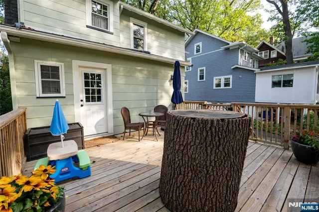 a backyard of a house with outdoor seating
