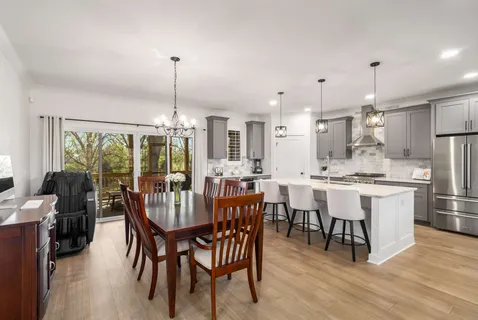 a bedroom with a large bed and a large window