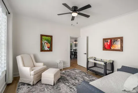 a bedroom with a bed and a couch