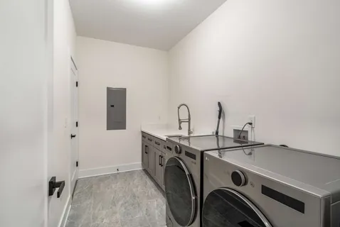 a bathroom with a granite countertop toilet sink and mirror