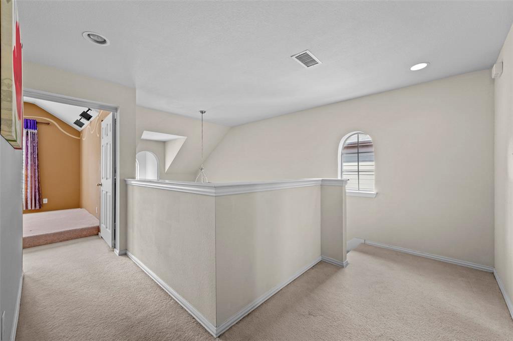 2405 Reston Drive McKinney, TX 75072 - Photo 19 of 38 Hallway featuring light colored carpet
