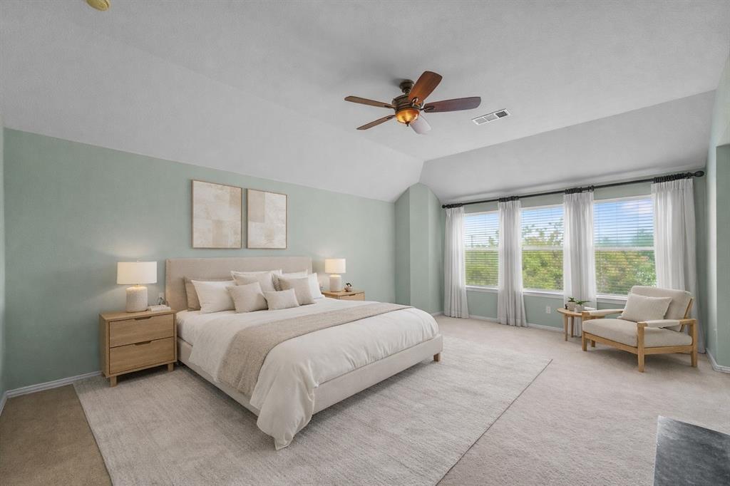 2405 Reston Drive McKinney, TX 75072 - Photo 22 of 38 The bedroom features light green walls, a ceiling fan, and three windows providing natural light