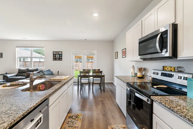 a kitchen with a stove and a microwave