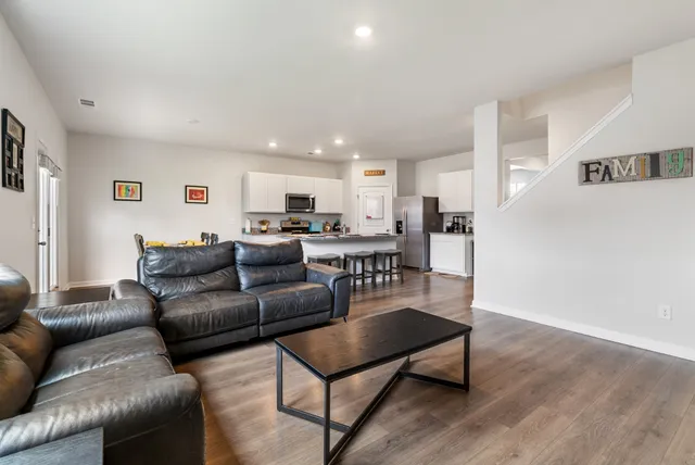 a living room with furniture and a table