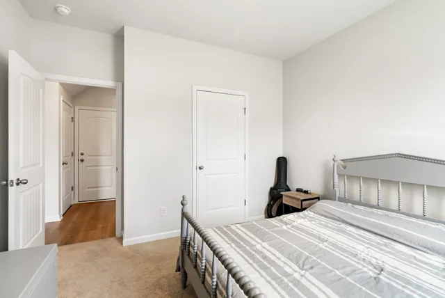 a bathroom with a granite countertop sink toilet a shower and a mirror