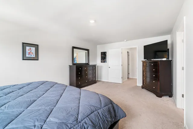 a bed room with a bed and furniture