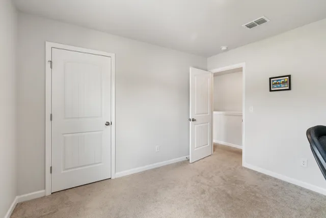a view of room with stairs and furniture