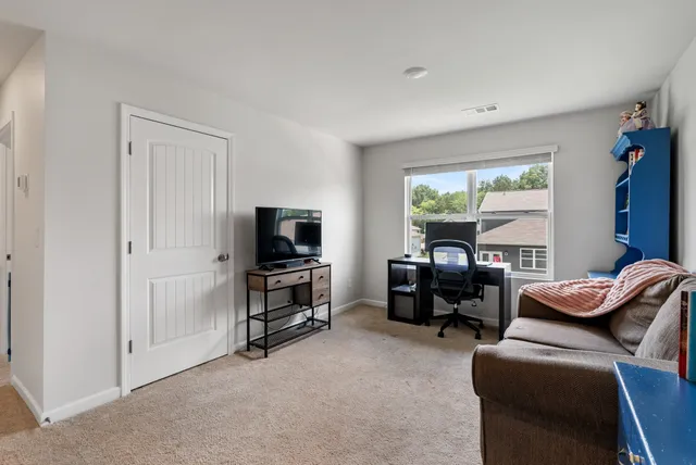 a white toilet sitting next to a bath tub