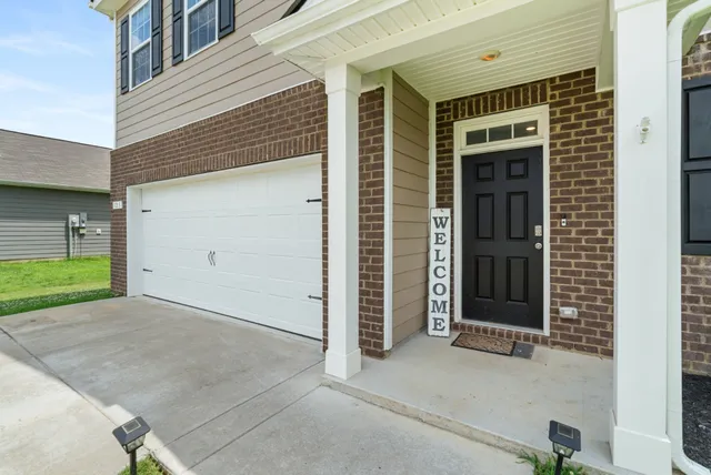 a view of a workspace with furniture