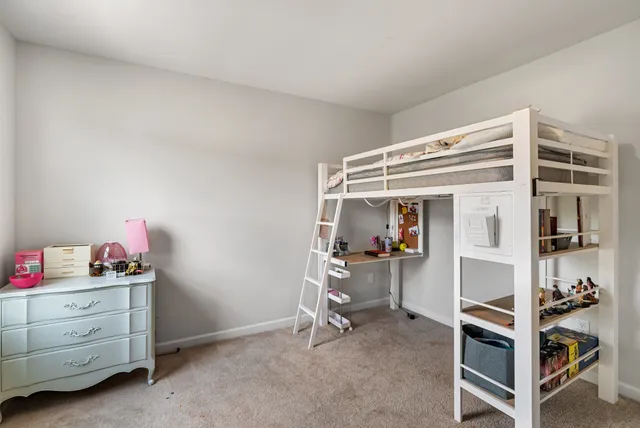 a room with a bed and a flat screen tv