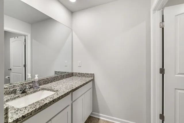 a view of a bench in the backyard