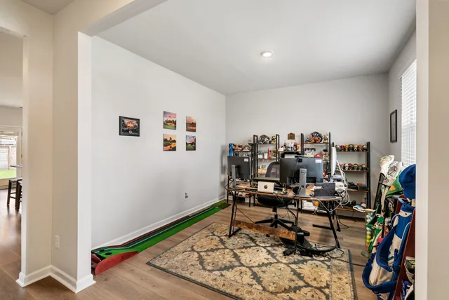 a room with furniture and a book shelf