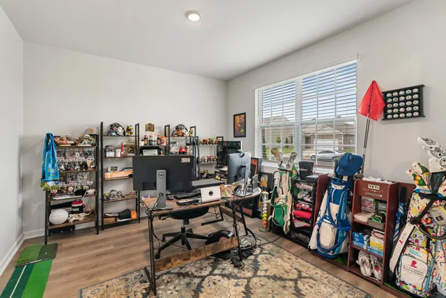 a workspace with furniture and a window