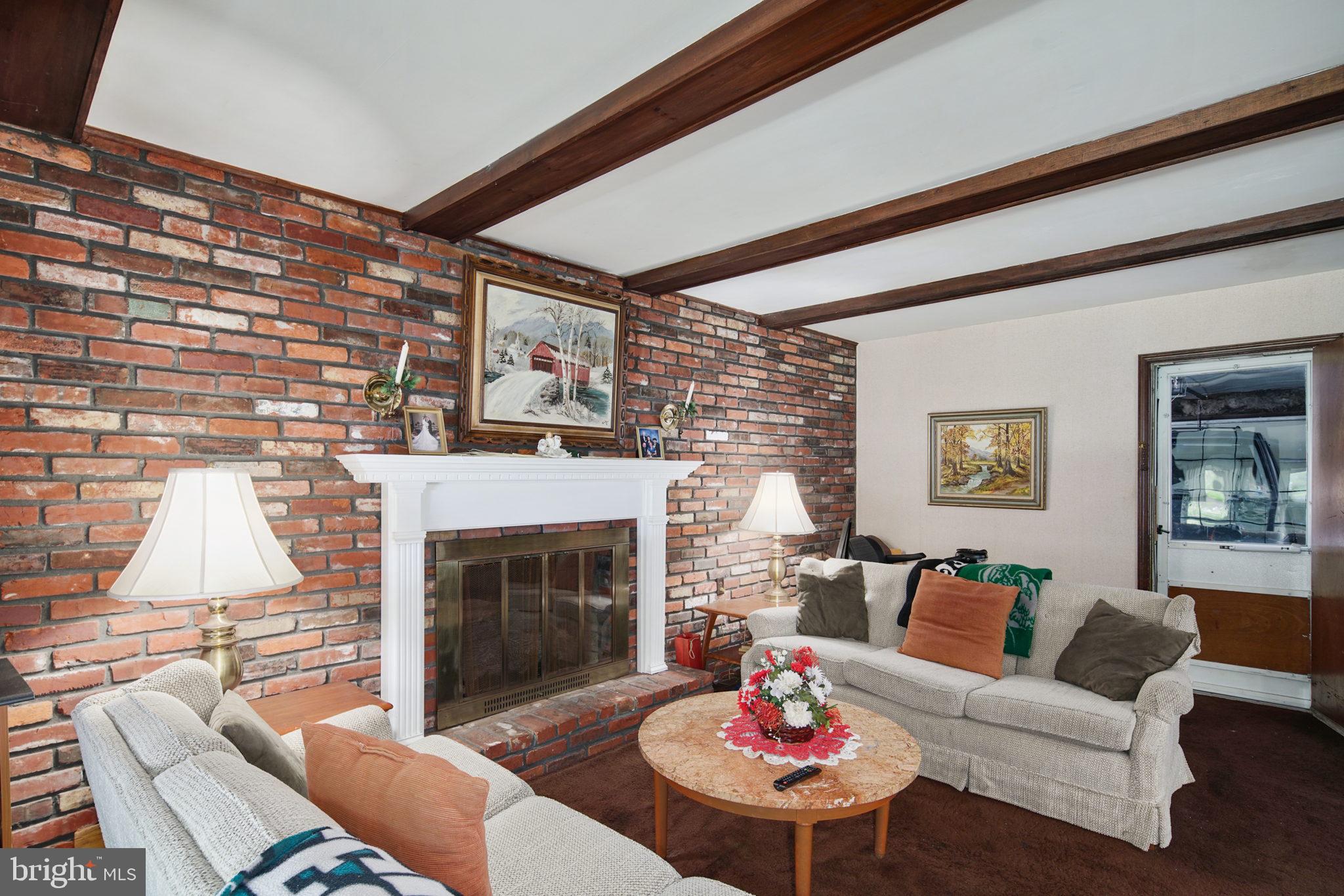 13 Madison Drive Clementon, NJ 08021 - Photo 11 of 36 a living room with furniture and a fireplace