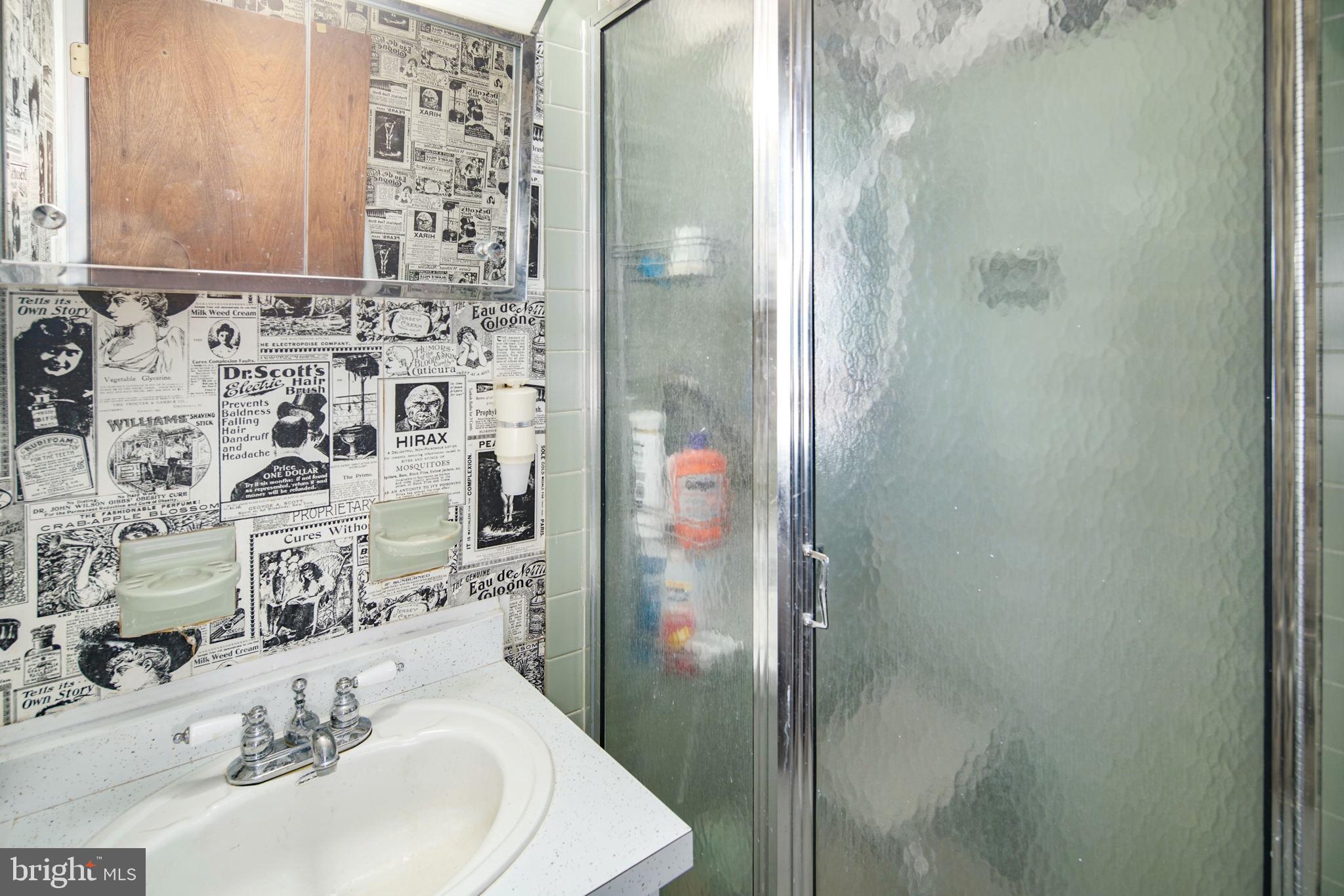 13 Madison Drive Clementon, NJ 08021 - Photo 14 of 36 a bathroom with a sink and a mirror