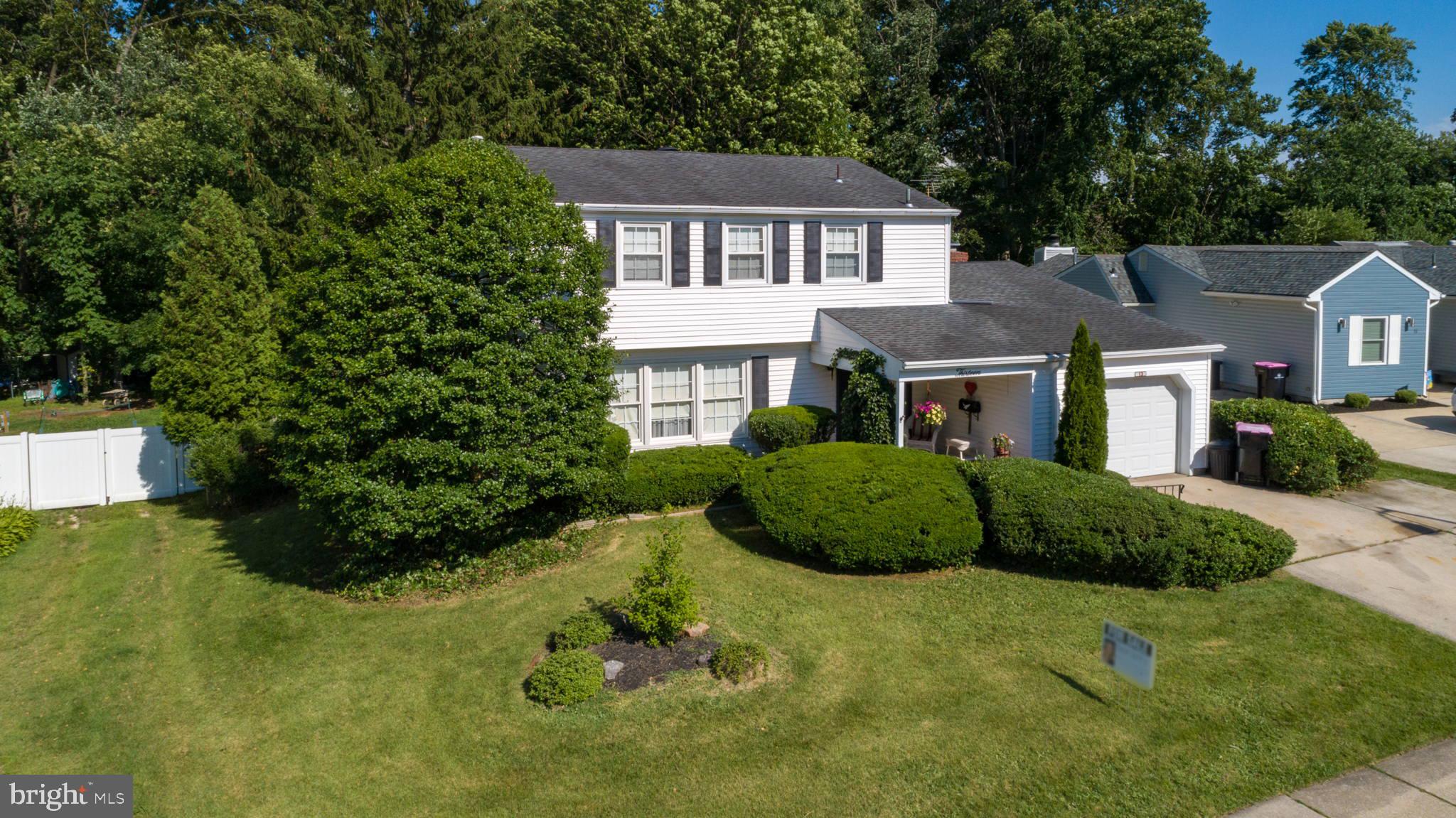 13 Madison Drive Clementon, NJ 08021 - Photo 2 of 36 a view of a big yard with plants and large trees