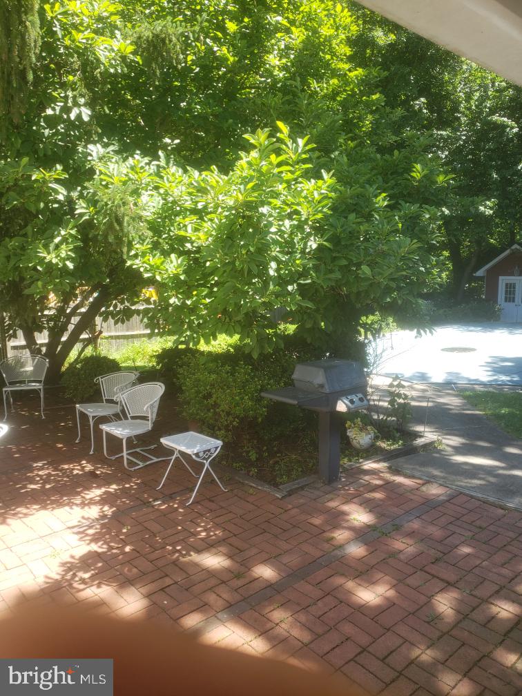 13 Madison Drive Clementon, NJ 08021 - Photo 26 of 36 a backyard of a house with table and chairs