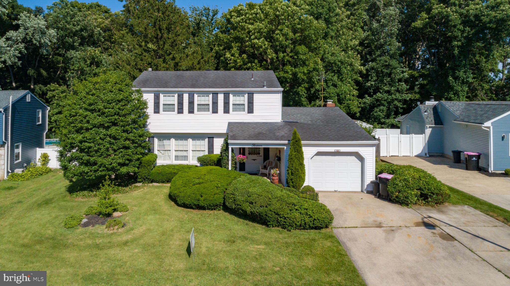 13 Madison Drive Clementon, NJ 08021 - Photo 29 of 36 a front view of a house with a garden and plants