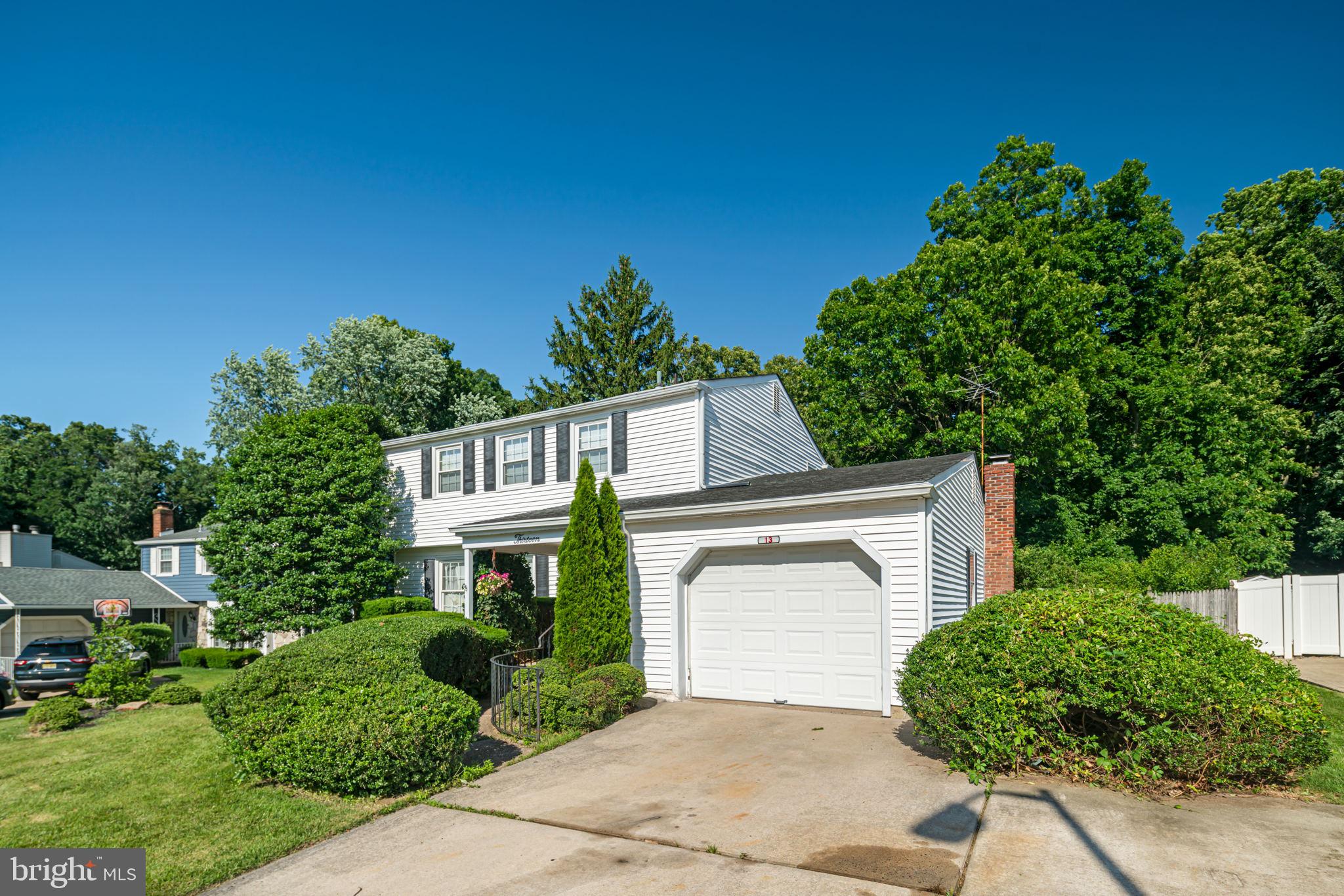 13 Madison Drive Clementon, NJ 08021 - Photo 3 of 36 a front view of a house with a yard and garage