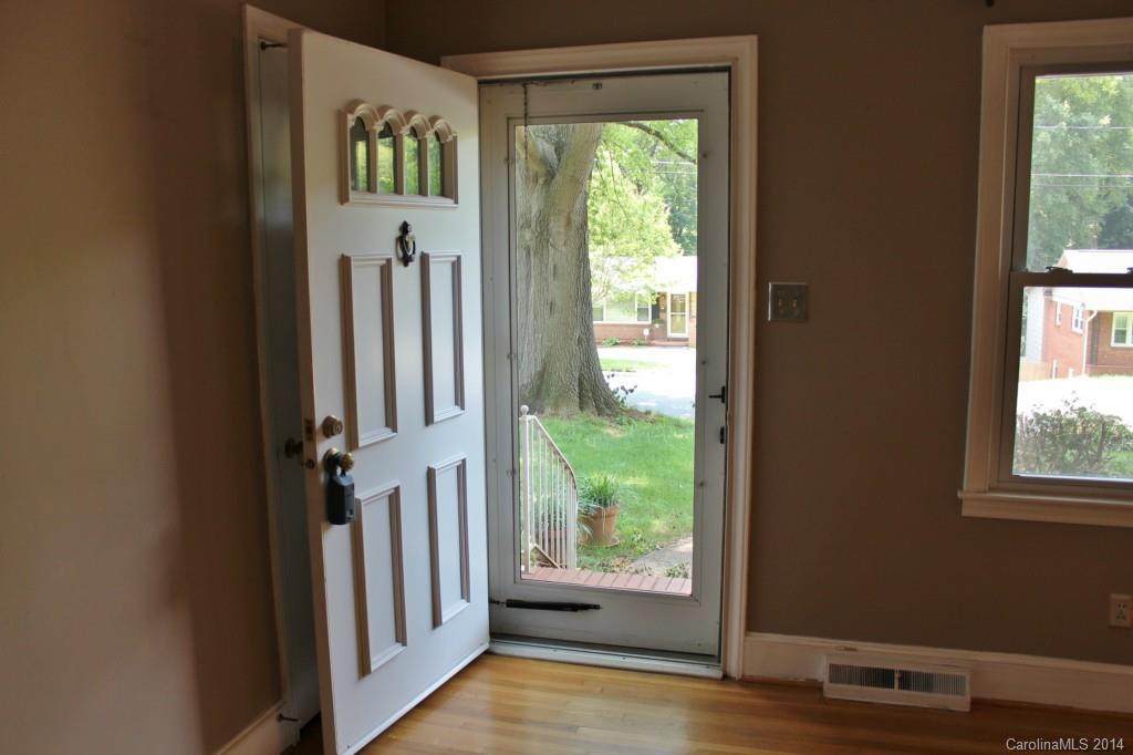 1510 Burnley Road Charlotte, NC 28210 - Photo 2 of 19 a view of an entryway with wooden floor and a window