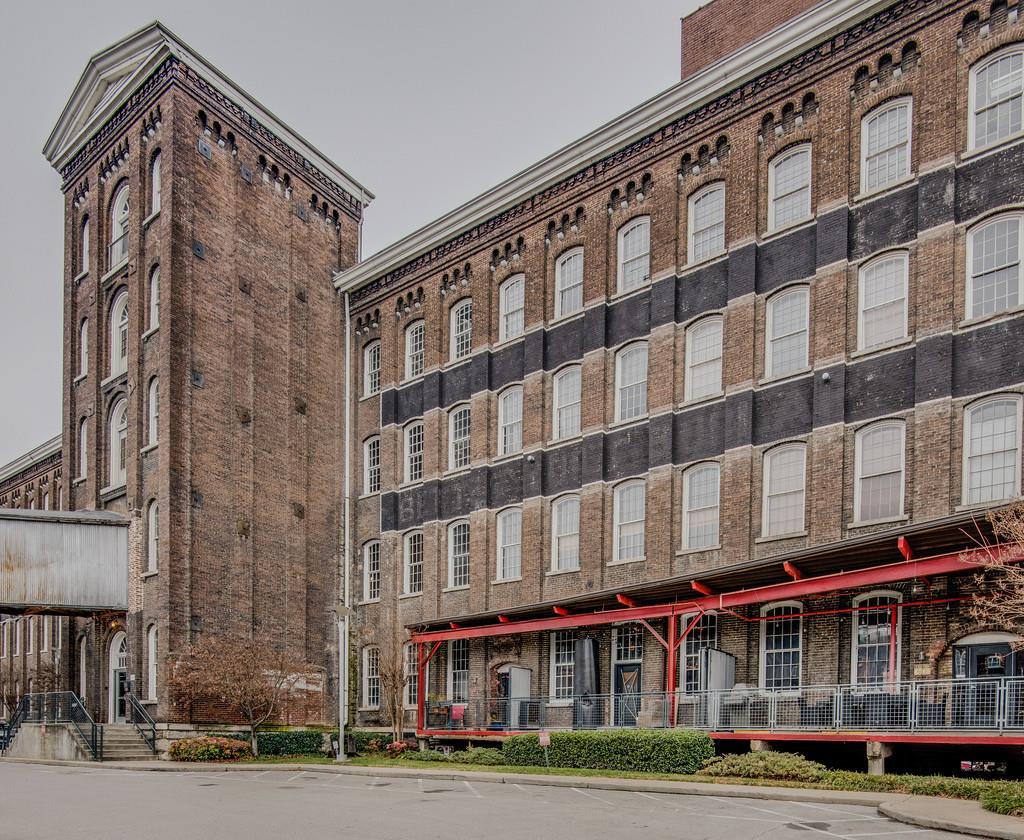 1400 Rosa L Parks Boulevard, Unit 323 Nashville, TN 37208 - Photo 1 of 25 a view of a building with a street