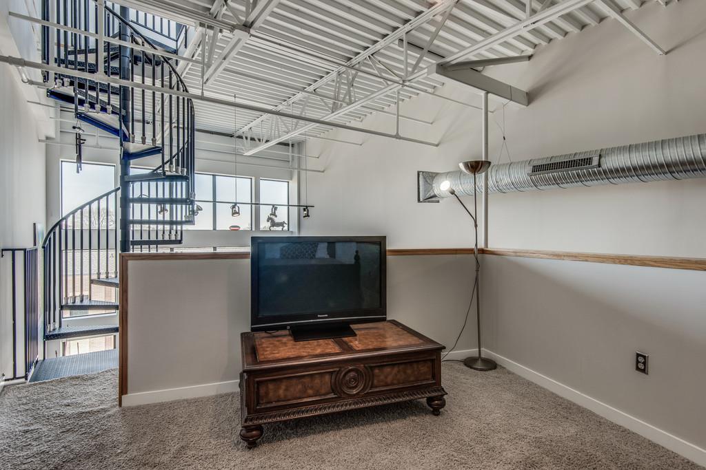 1400 Rosa L Parks Boulevard, Unit 323 Nashville, TN 37208 - Photo 19 of 25 a living room with a couch and a ceiling fan
