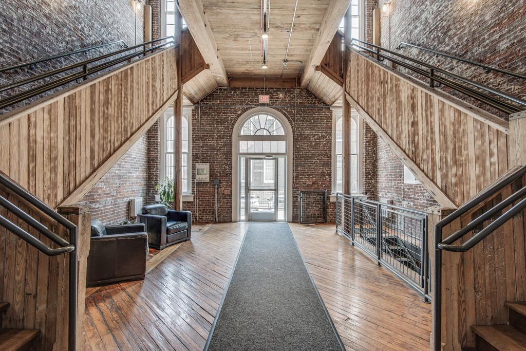 1400 Rosa L Parks Boulevard, Unit 323 Nashville, TN 37208 - Photo 2 of 25 a view of entryway and hall with wooden floor