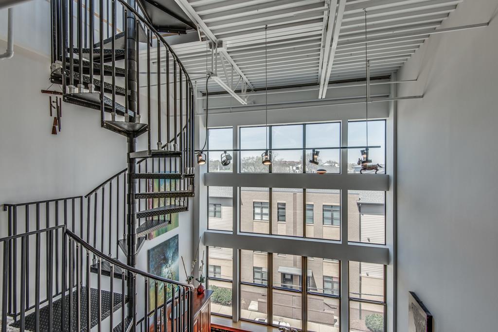 1400 Rosa L Parks Boulevard, Unit 323 Nashville, TN 37208 - Photo 21 of 25 a view of staircase with lots of frames on wall and a window