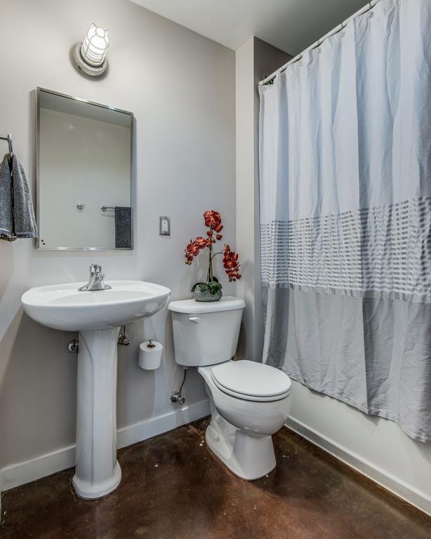1400 Rosa L Parks Boulevard, Unit 323 Nashville, TN 37208 - Photo 5 of 25 a bathroom with a sink toilet and a mirror