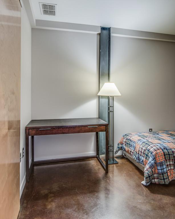 1400 Rosa L Parks Boulevard, Unit 323 Nashville, TN 37208 - Photo 7 of 25 a bedroom with a bed and lamp